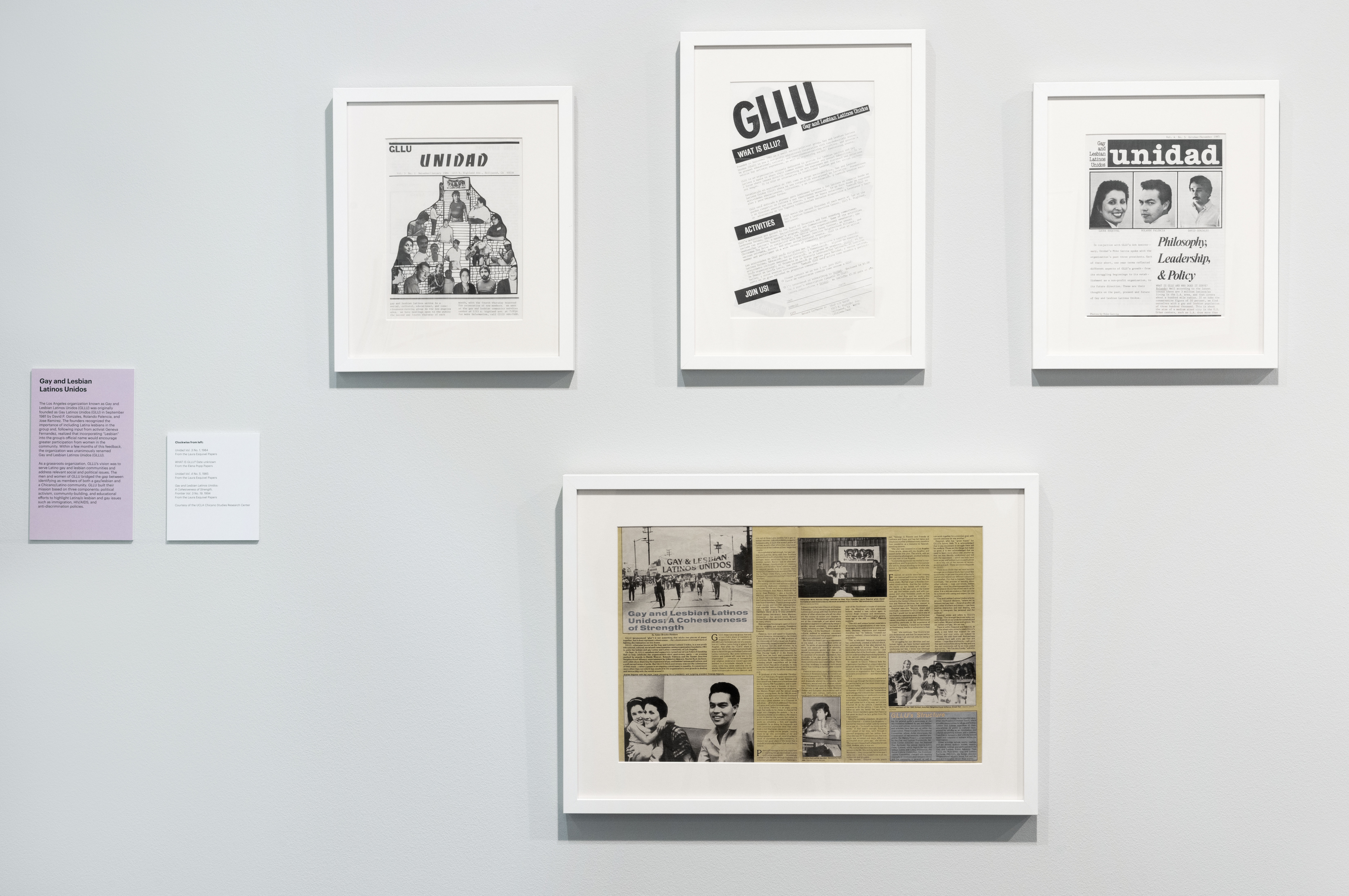 a photograph of framed works on a wall
